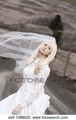 Stock Image - A young woman in a bridal gown. Fotosearch