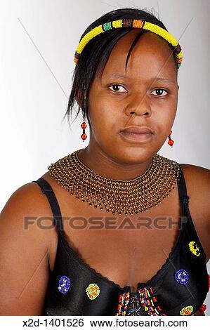 Stock Photograph - A young woman in traditional Zulu dress South Africa. Fotosearch