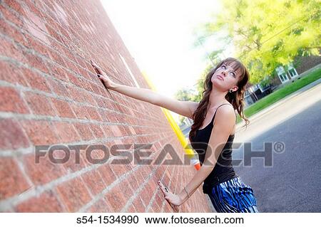 Stock Image - A young woman outdoors in Spokane, Washington, USA. Fotosearch