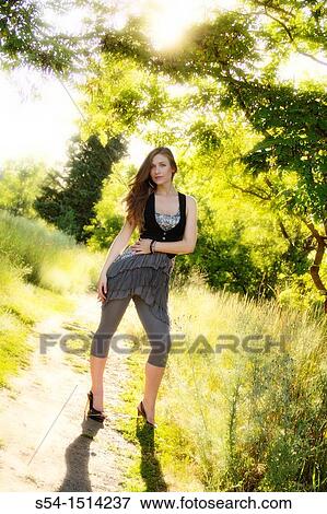 A young woman outdoors in Spokane, Washington, USA View Large Photo Image Stock Photo - A young woman outdoors in Spokane, Washington, USA. Fotosearch