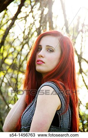 A young woman outdoors in the springtime View Large Photo Image Stock Image - A young woman outdoors in the springtime. Fotosearch