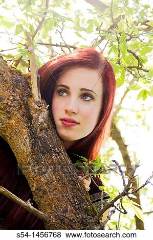 A young woman outdoors in the springtime View Large Photo Image Stock Photo - A young woman outdoors in the springtime. Fotosearch