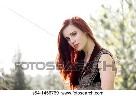 A young woman outdoors in the springtime View Large Photo Image Stock Photo - A young woman outdoors in the springtime. Fotosearch