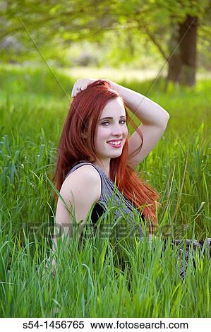 A young woman outdoors in the springtime View Large Photo Image Stock Photography - A young woman outdoors in the springtime. Fotosearch