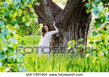 Picture - A young woman outdoors in the summer in Spokane, Washington, USA.. Fotosearch