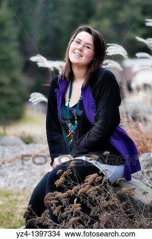 A young woman outdoors View Large Photo Image Picture - A young woman outdoors. Fotosearch