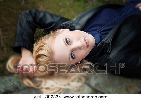 A young woman outdoors View Large Photo Image Picture - A young woman outdoors. Fotosearch