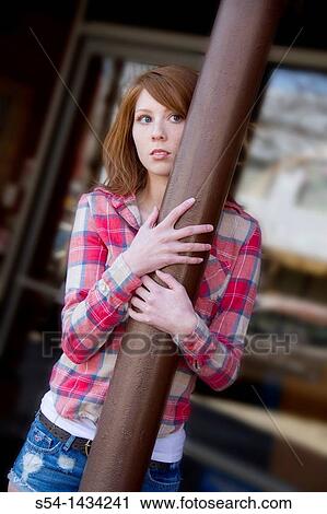 A young woman outdoors View Large Photo Image Stock Image - A young woman outdoors. Fotosearch