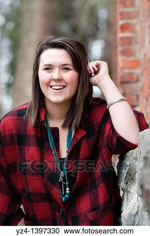 Stock Image - A young woman outdoors. Fotosearch