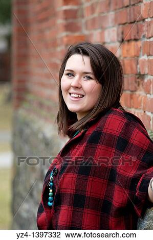 Stock Image - A young woman outdoors. Fotosearch