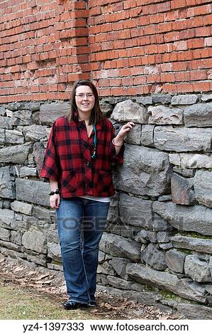 A young woman outdoors View Large Photo Image Stock Image - A young woman outdoors. Fotosearch