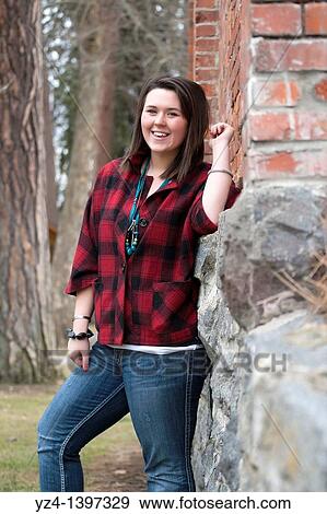 A young woman outdoors View Large Photo Image Stock Photo - A young woman outdoors. Fotosearch