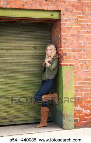 A young woman outdoors View Large Photo Image Stock Photography - A young woman outdoors. Fotosearch