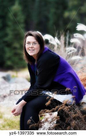 Stock Photography - A young woman outdoors. Fotosearch