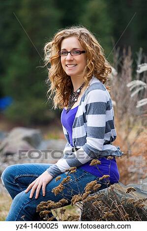 A young woman outdoors View Large Photo Image Stock Photography - A young woman outdoors. Fotosearch