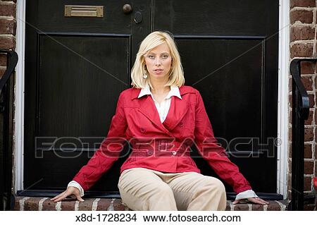 A young woman sits on the front steps of her home, Charleston, South Carolina, USA View Large Photo Image Picture - A young woman sits on the front steps of her home, Charleston, South Carolina, USA. Fotosearch
