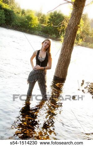 A young woman standing in the Spokane River, Spokane, Washington, USA View Large Photo Image Stock Image - A young woman standing in the Spokane River, Spokane, Washington, USA. Fotosearch