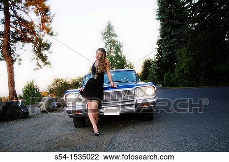 A young woman with a 1964 Chevrolet Impala in Spokane, Washington, USA. View Large Photo Image Stock Image - A young woman with a 1964 Chevrolet Impala in Spokane, Washington, USA.. Fotosearch