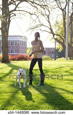 A young woman with a pitbull mix dog View Large Photo Image Stock Image - A young woman with a pitbull mix dog. Fotosearch