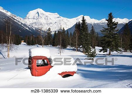 Abandoned 1950's era red truck covered in snow, Mount Robson Provincial Park British Columbia Canada View Large Photo Image Stock Photo - Abandoned 1950's era red truck covered in snow, Mount Robson Provincial Park British Columbia Canada. Fotosearch