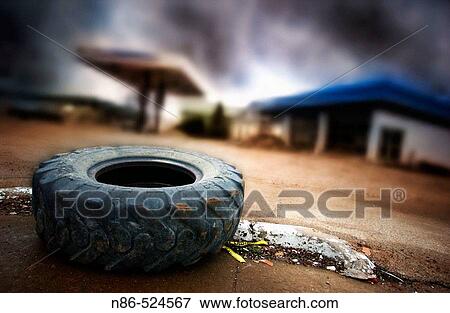 Abandoned gas station with truck tire View Large Photo Image Stock Photo - Abandoned gas station with truck tire. Fotosearch