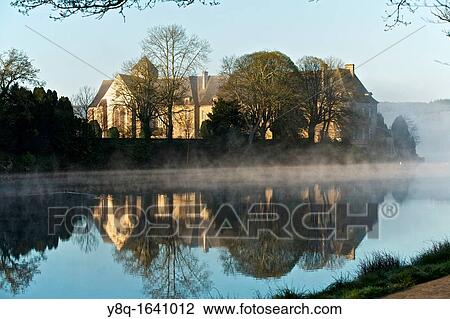 Stock Image - Abbey paimpont and pond. broceliande, Ille et Vilaine, brittany, france. Judicael, d. 658, founded the first prioress of Paimpont in 645.. Fotosearch