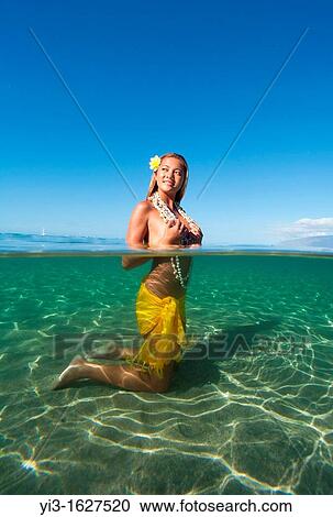 Above and below the water of a local girl with shells in Lahaina, Maui, Hawaii View Large Photo Image Stock Image - Above and below the water of a local girl with shells in Lahaina, Maui, Hawaii. Fotosearch