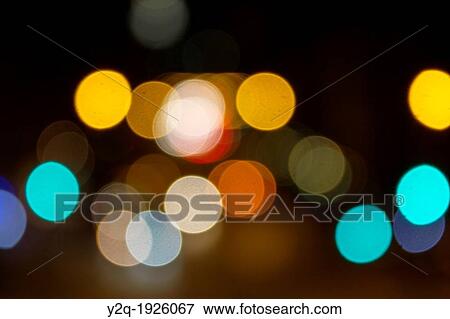 Stock Photo - Abstract circular bokeh of car lights at night in New York City, New York USA. Fotosearch