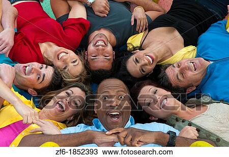 Abstract from above of many multi ethnic friends in playground laughing and sharing fun in spinning wheel of colors together View Large Photo Image Stock Image - Abstract from above of many multi ethnic friends in playground laughing and sharing fun in spinning wheel of colors together. Fotosearch