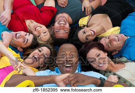 Abstract from above of many multi ethnic friends in playground laughing and sharing fun in spinning wheel of colors together View Large Photo Image Stock Photography - Abstract from above of many multi ethnic friends in playground laughing and sharing fun in spinning wheel of colors together. Fotosearch