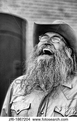 Abstract portrait of laughing cowboy with gray beard in Billings Montana View Large Photo Image Picture - Abstract portrait of laughing cowboy with gray beard in Billings Montana. Fotosearch