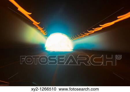 Abstracted picture of blurred lights in tunnel View Large Photo Image Stock Image - Abstracted picture of blurred lights in tunnel. Fotosearch