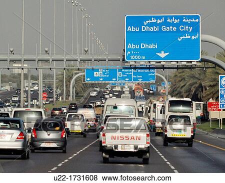 Abu Dhabi, United Arab Emirates: traffic along a road View Large Photo Image Stock Photo - Abu Dhabi, United Arab Emirates: traffic along a road. Fotosearch