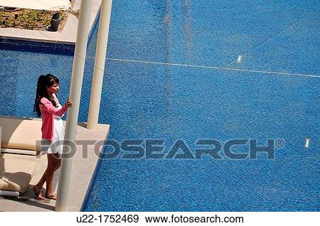 Abu Dhabi, United Arab Emirates: woman at the swimming pool of Hotel Park Hyatt Abu Dhabi, Saadiyat Island View Large Photo Image Stock Photo - Abu Dhabi, United Arab Emirates: woman at the swimming pool of Hotel Park Hyatt Abu Dhabi, Saadiyat Island. Fotosearch