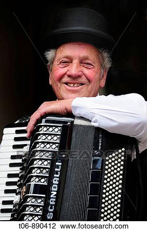Accordionist in traditionnal dress of year 1900 Festival of the Norman language in St Peter Port Guernsey, Channel Islands, UK View Large Photo Image Stock Image - Accordionist in traditionnal dress of year 1900 Festival of the Norman language in St Peter Port Guernsey, Channel Islands, UK. Fotosearch