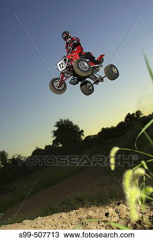action, motocross, solo caucasian male jumping All-Terrain-Vehicle. Kansas City, Missouri, USA View Large Photo Image Stock Image - action, motocross, solo caucasian male jumping All-Terrain-Vehicle. Kansas City, Missouri, USA. Fotosearch