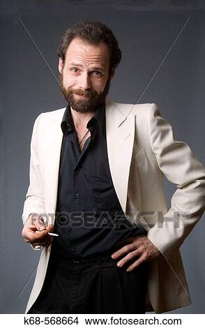Actor in white jacket with cigarette, man, 40 View Large Photo Image Picture - Actor in white jacket with cigarette, man, 40. Fotosearch
