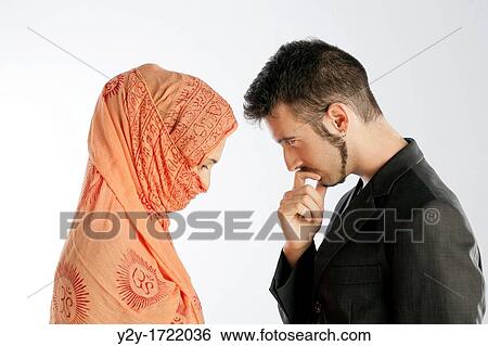 Stock Photograph - Actors representing a man and a muslim woman. Fotosearch