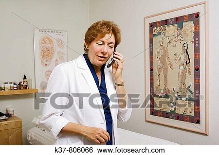 Acupuncture therapist on the phone View Large Photo Image Stock Photograph - Acupuncture therapist on the phone. Fotosearch