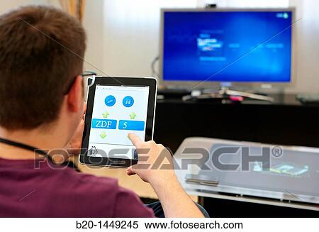 Adaptive user interface for control applications, changing tv channels with iPad, Vicomtech-IK4 Visual Interaction and Communication Technologies Centre View Large Photo Image Stock Photography - Adaptive user interface for control applications, changing tv channels with iPad, Vicomtech-IK4 Visual Interaction and Communication Technologies Centre. Fotosearch