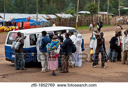 Addis Ababa Ethiopia Africa church people crowding into small van at Church of St Mary in Shero Meda area View Large Photo Image Stock Photo - Addis Ababa Ethiopia Africa church people crowding into small van at Church of St Mary in Shero Meda area. Fotosearch