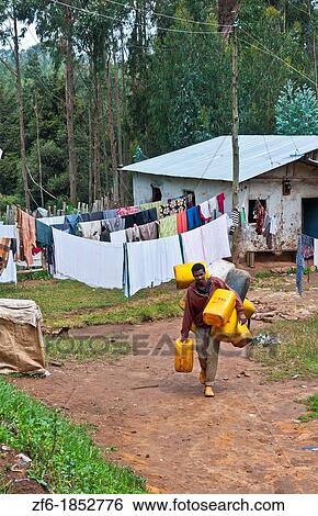 Stock Photograph - Addis Ababa Ethiopia Africa poor neighborhood and homes with local people in Shero Meda area. Fotosearch