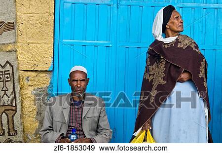 Addis Ababa Ethiopia Capital Africa local man and woman against blue door with scarf and hat 31 View Large Photo Image Stock Photo - Addis Ababa Ethiopia Capital Africa local man and woman against blue door with scarf and hat 31. Fotosearch