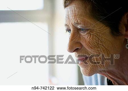 Stock Image - Adela, mirando con ternura a su nuevo nieto.. Fotosearch