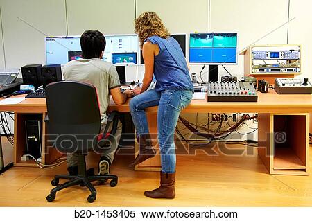 Stock Photography - Adjusting controls in TV set, Digital Television and Multimedia Services, Vicomtech-IK4 Visual Interaction and Communication Technologies Centre, applied research centre for Interactive Computer Graphics and Multimedia, San Sebastian Technology Park. Fotosearch