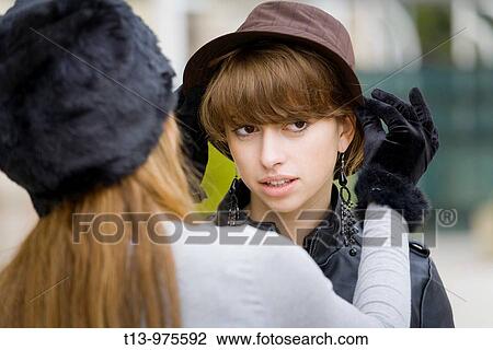 Adjusting hat View Large Photo Image Stock Image - Adjusting hat. Fotosearch
