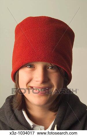 Adolescent boy in red hat View Large Photo Image Stock Photo - Adolescent boy in red hat. Fotosearch