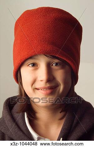 Adolescent boy in red hat View Large Photo Image Stock Photo - Adolescent boy in red hat. Fotosearch