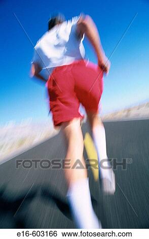 Adult running on deserted road View Large Photo Image Stock Photograph - Adult running on deserted road. Fotosearch