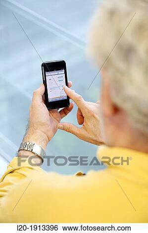 Stock Photograph - Adult with smartphone. Fotosearch